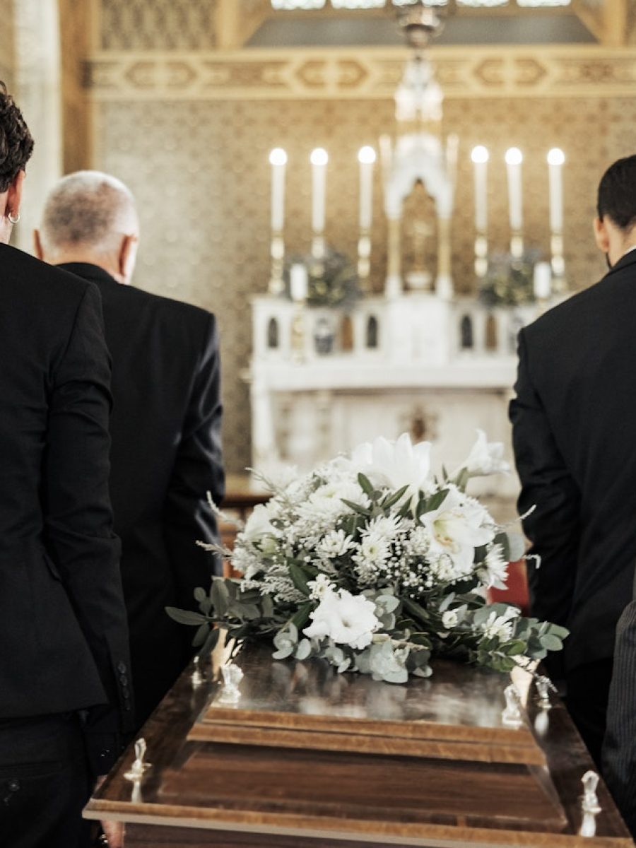 funeral-church-and-group-carry-coffin-in-service-death-or-sermon-for-burial-with-support-friends.jpg